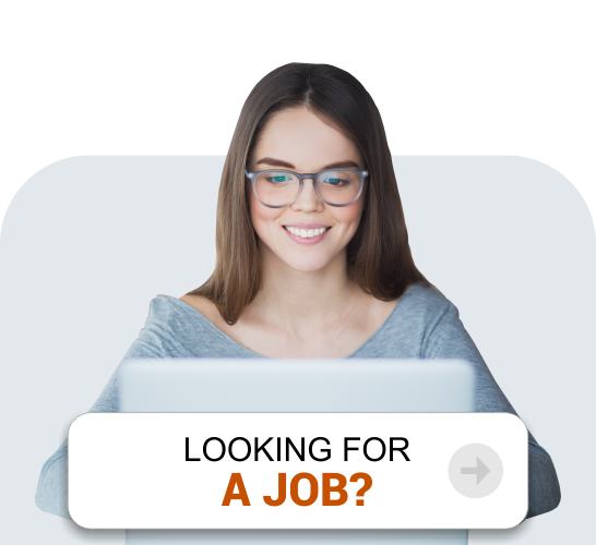 A professional woman wearing spectacles and smiling while looking for a job on the laptop